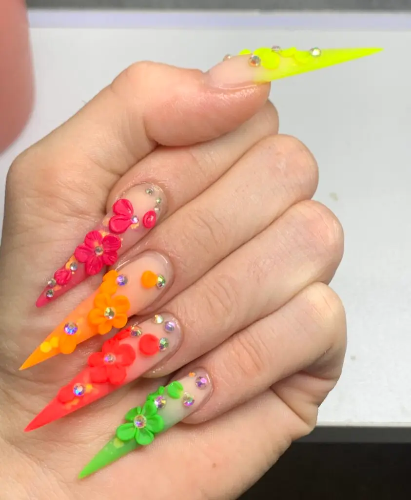 Kira designing acrylic nails with 3D art at NAB Nail Bar.