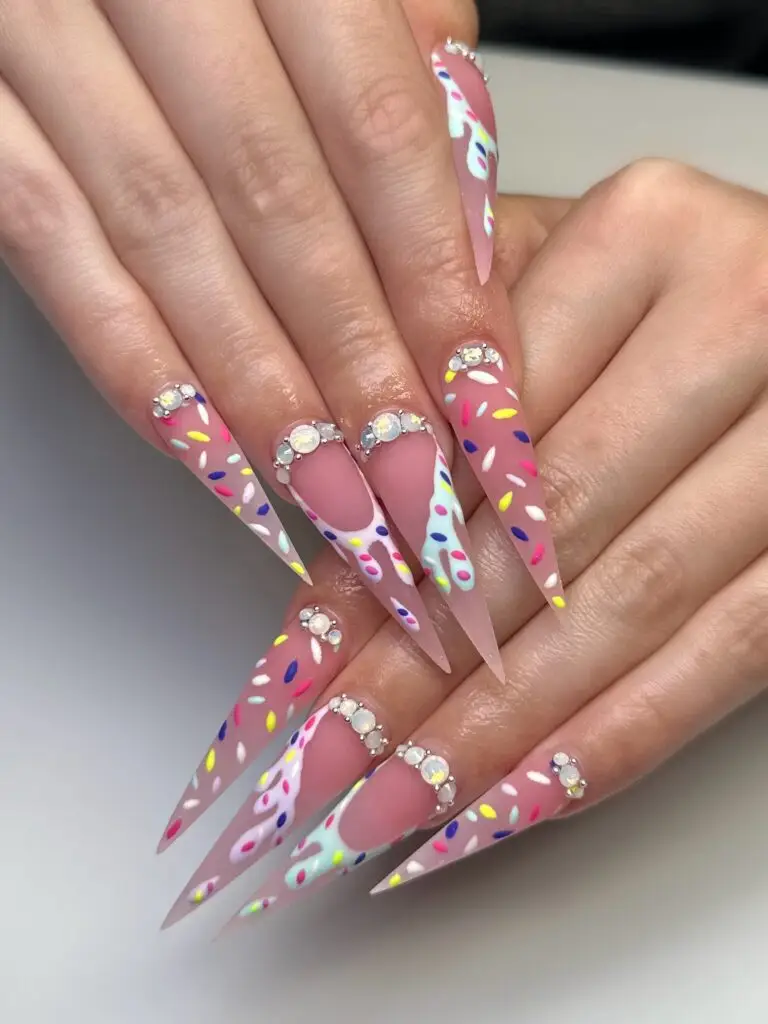 Intricate holiday-themed nail art with detailed hand-painting