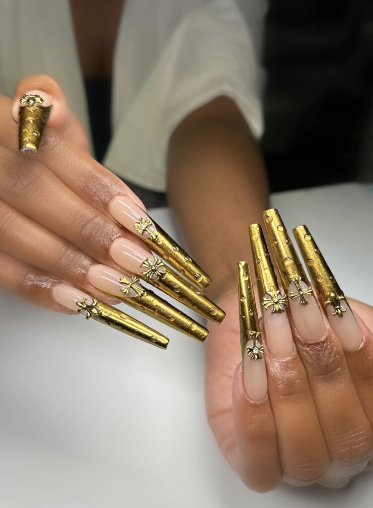 Elegant gold nails designed for a festive New Year's Eve look and trendy nail ideas.