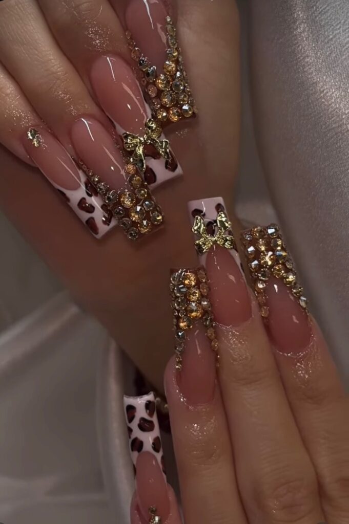 Leopard print nail design with a classic French tip, featuring bold patterns and a sleek, stylish finish.