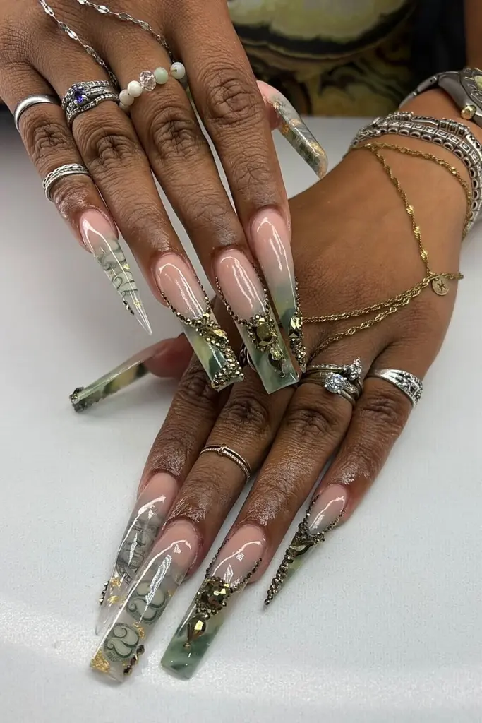 Extra-long encapsulated acrylic stiletto set with jade marble and gold accents at NAB Nail Bar, Las Vegas