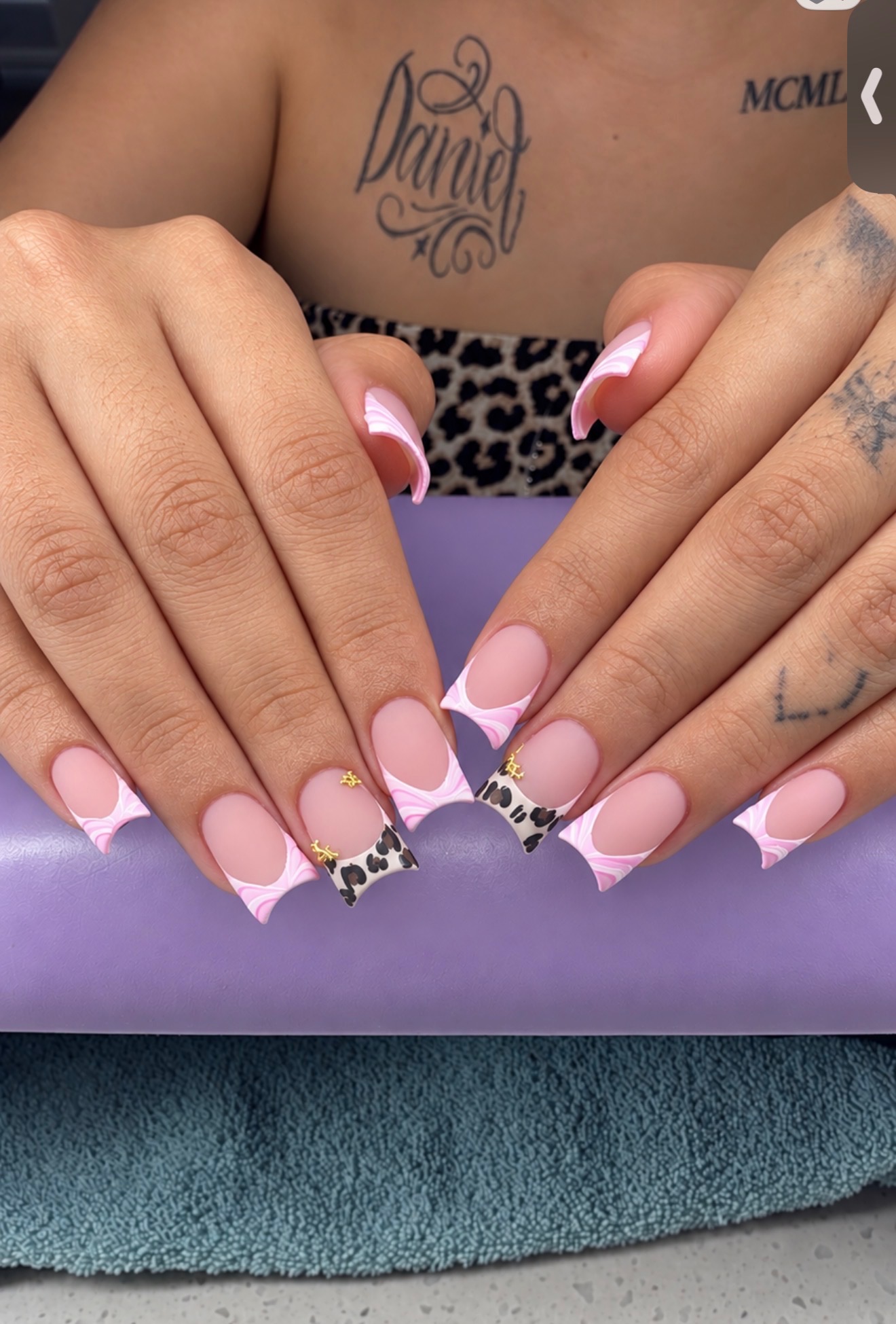 Nga nail art — nude base with marble French tips and leopard accent nails at NAB Nail Bar Las Vegas