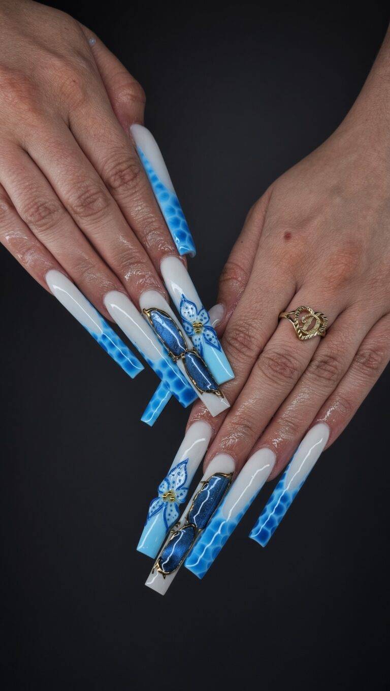Long coffin nails with white and blue ombré and butterfly decals gold accents on two nails hand wearing a gold ring against a dark background Nab nail bar | nails lashes and beauty in las vegas
