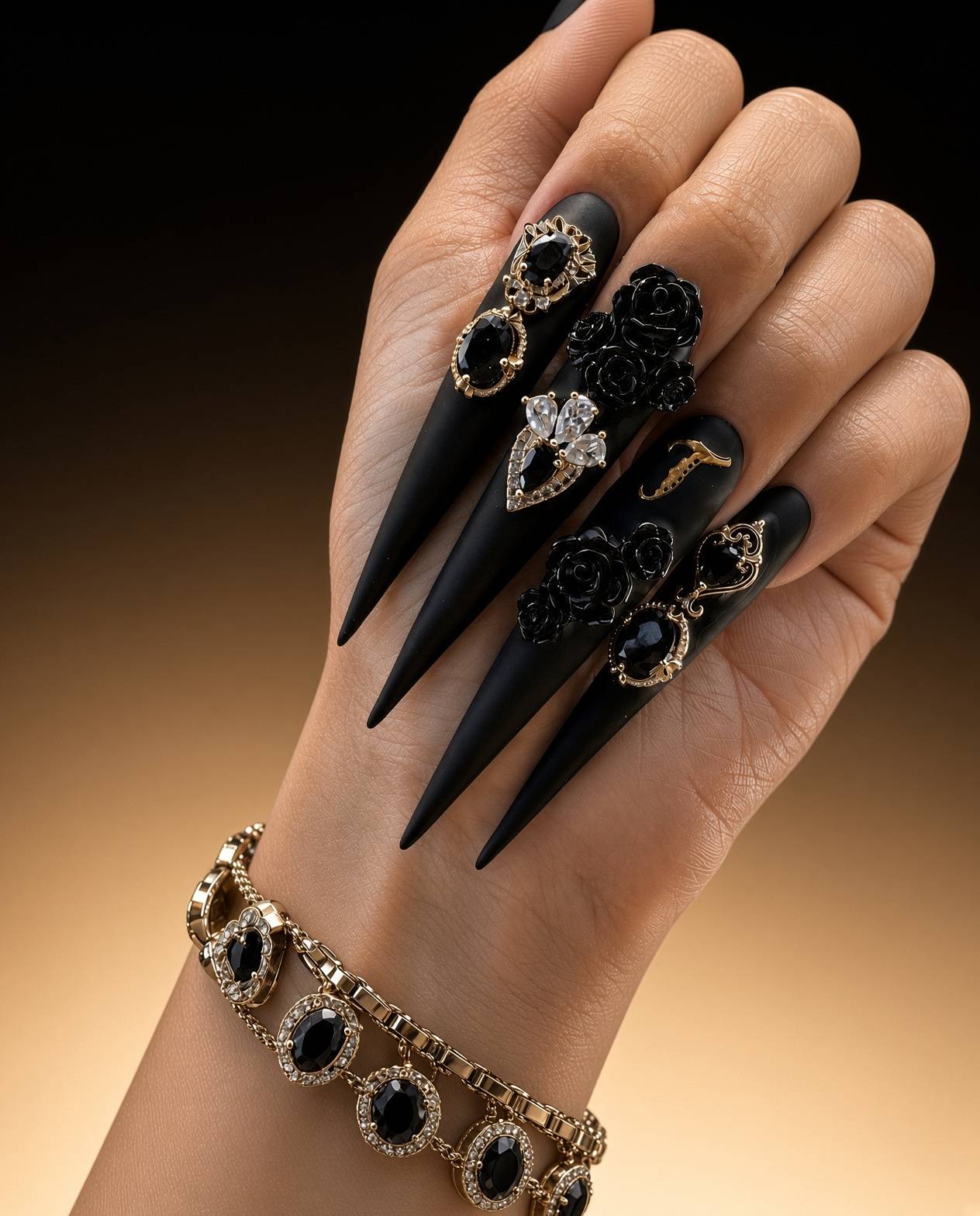Long black stiletto gel x nails with gold and black jewelled charms and black roses done at nab nail bar in las vegas nab nail bar