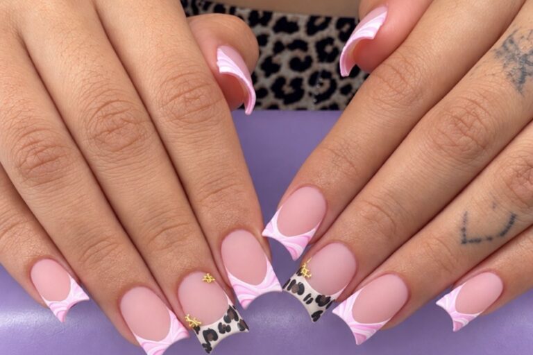Duck nails with pink french tips white swirls and leopard print accent nails showing the flared tip that gives the shape its name nab nail bar | nails lashes and beauty in las vegas