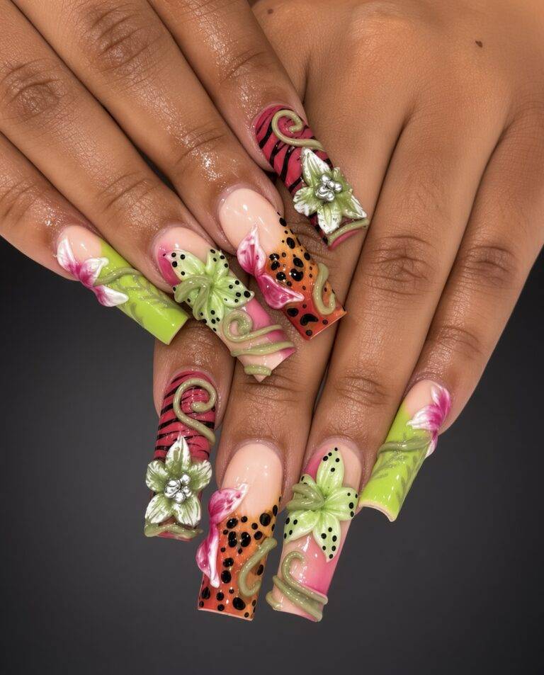Close up of hands displaying long acrylic nails with bright pink green and peach designs featuring 3d flowers and vine details Nab nail bar | nails lashes and beauty in las vegas