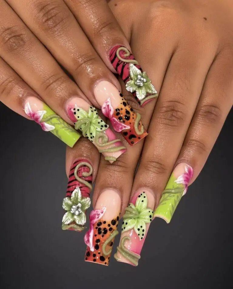 Green 3d Flowers Mobile Nab Nail Bar | Nails Lashes and Beauty in Las Vegas Close up of hands displaying long acrylic nails with bright pink green and peach designs featuring 3d flowers and vine details Nab nail bar | nails lashes and beauty in las vegas