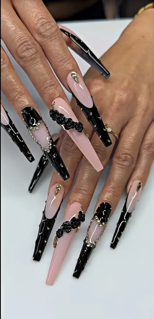 Extra long coffin Gel X nails with a black French tip, black 3D roses and gold studs at NAB Nail Bar in Las Vegas