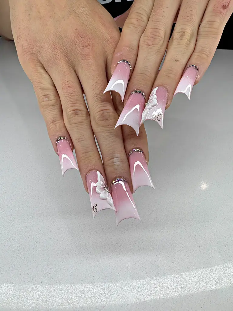 Extra long gel x duck nails in pink ombré with rhinestones and 3d flowers at nab nail bar in las vegas nab nail bar
