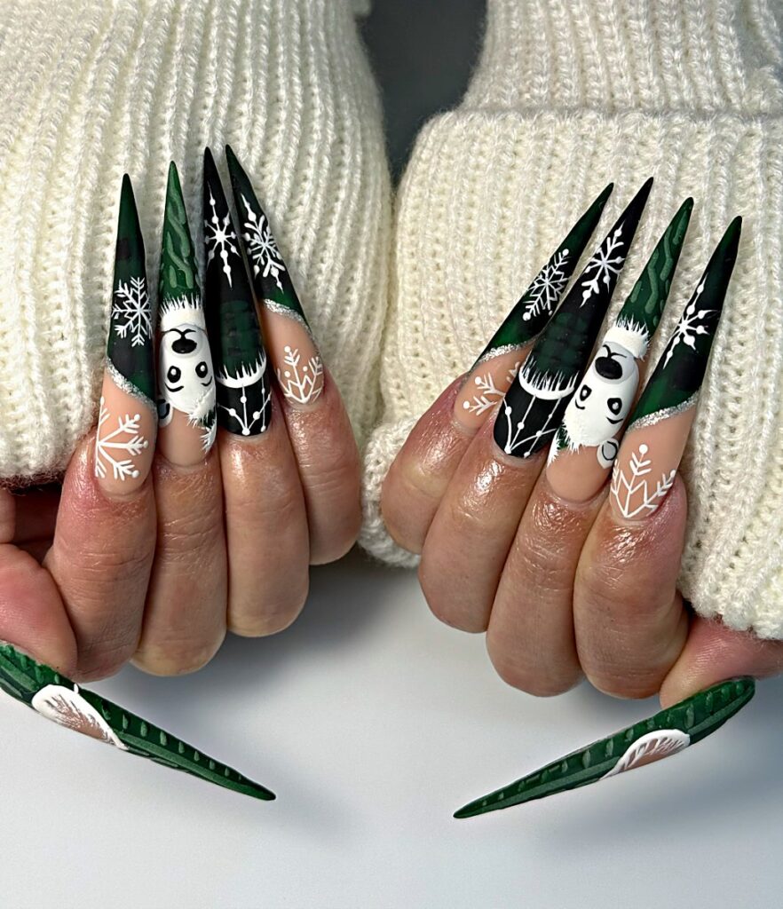 Dark green Christmas stiletto nails with hand-painted snowflakes, snowmen and 3D sweater texture at NAB Nail Bar, Las Vegas