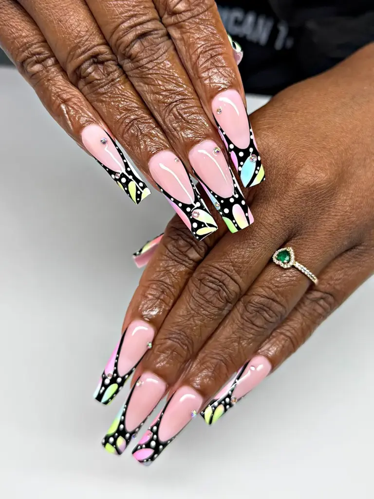 Long square Gel X nails with a black butterfly wing French tip, pastel ombré and crystals at NAB Nail Bar in Las Vegas