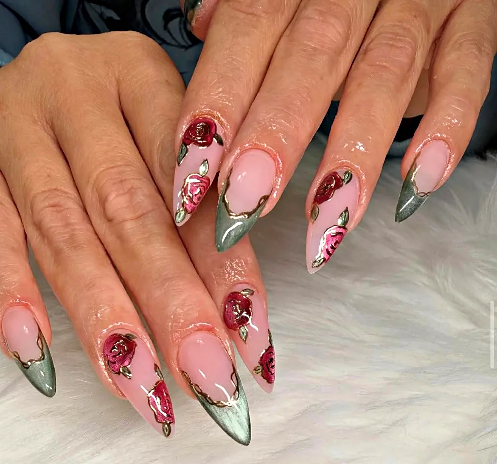 Long stiletto Gel X nails with sage cat eye French tips, red roses and gold outlines at NAB Nail Bar in Las Vegas
