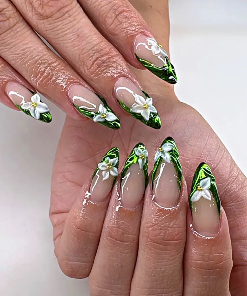 Medium almond Gel X nails with green chrome French tips and white 3D flowers at NAB Nail Bar in Las Vegas
