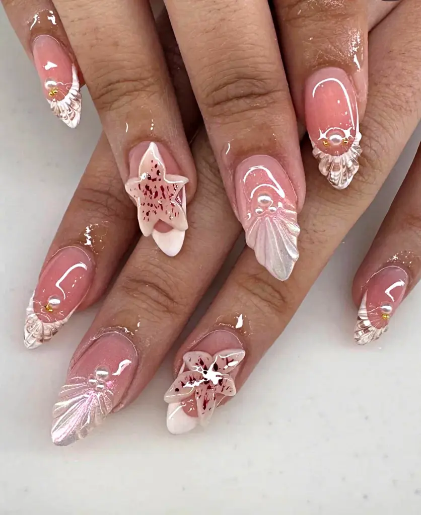 Medium almond Gel X nails with pink seashell tips, 3D starfish and pearls at NAB Nail Bar in Las Vegas