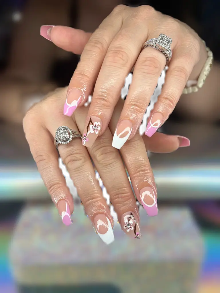 Medium coffin Gel X nails with pink and white French tips and hand-painted cherry blossoms at NAB Nail Bar in Las Vegas