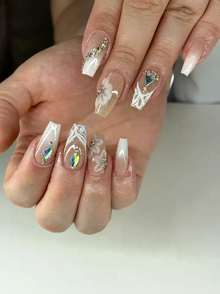 Medium coffin Gel X nails in white ombré with crystals, 3D white flowers and sugar lace at NAB Nail Bar in Las Vegas