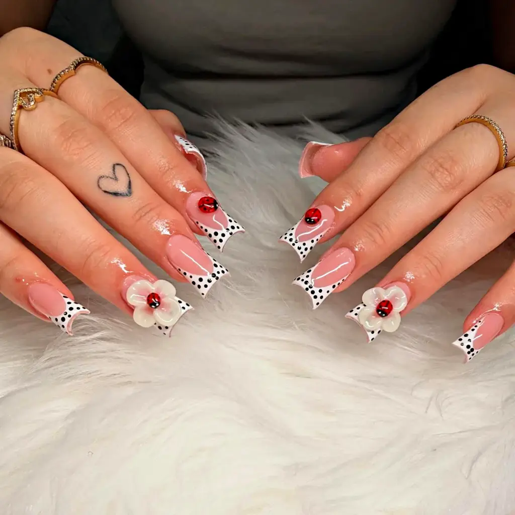 Medium gel x duck nails with a polka dot french tip ladybugs and 3d flowers at nab nail bar in las vegas nab nail bar