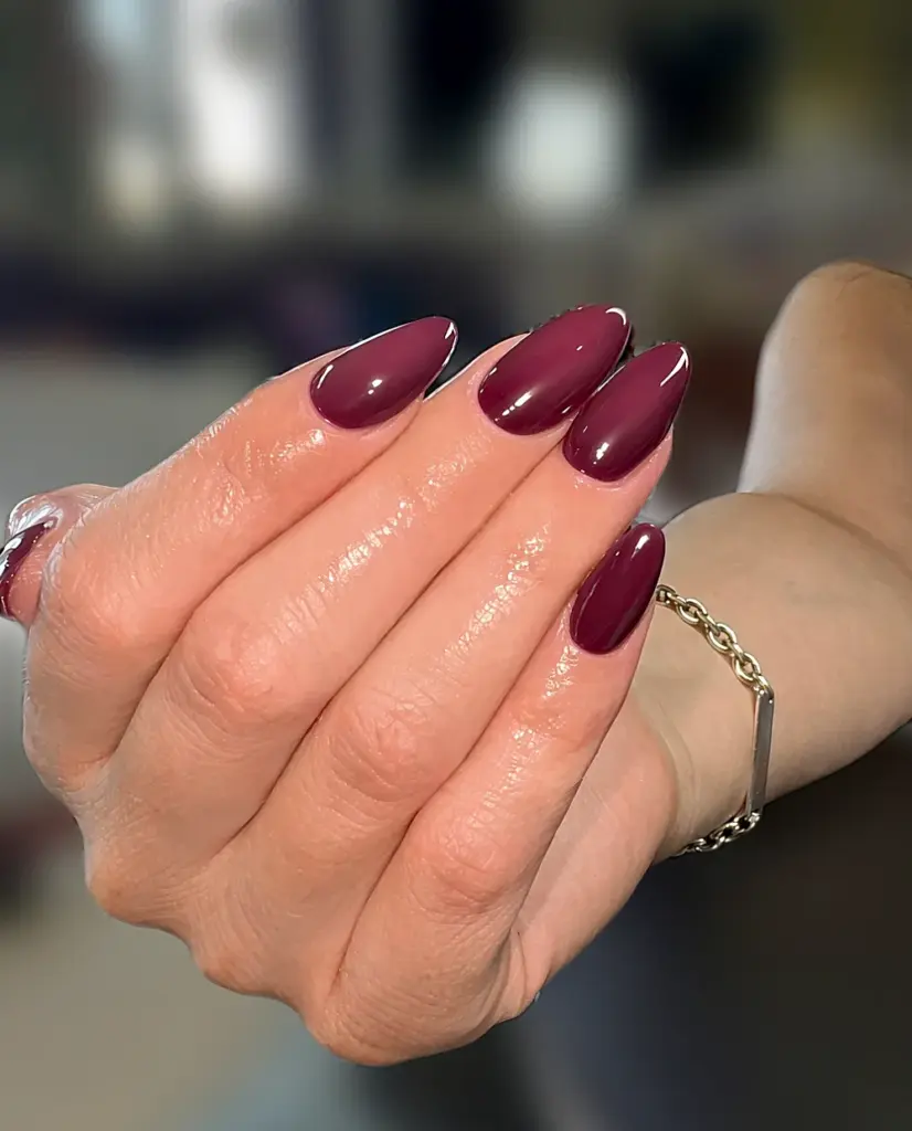 Medium oval Gel X nails in a glossy burgundy wine colour at NAB Nail Bar in Las Vegas