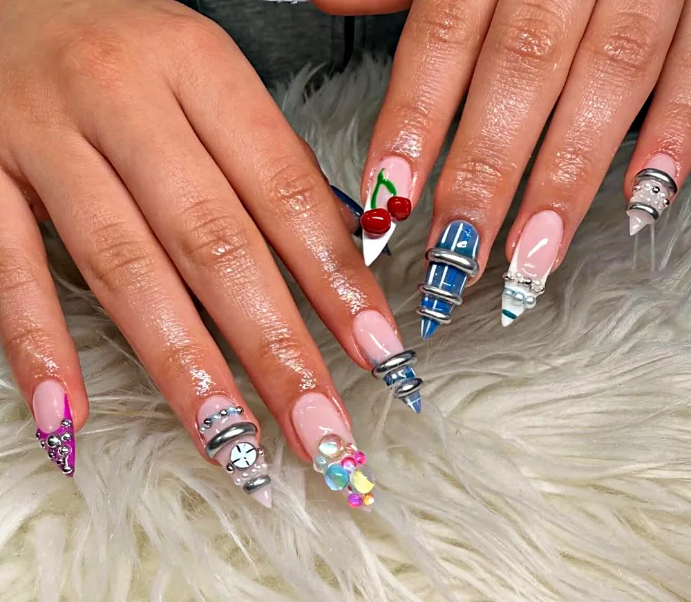 Medium stiletto Gel X nails with 3D cherries, silver rings, pearls and jelly gems at NAB Nail Bar in Las Vegas