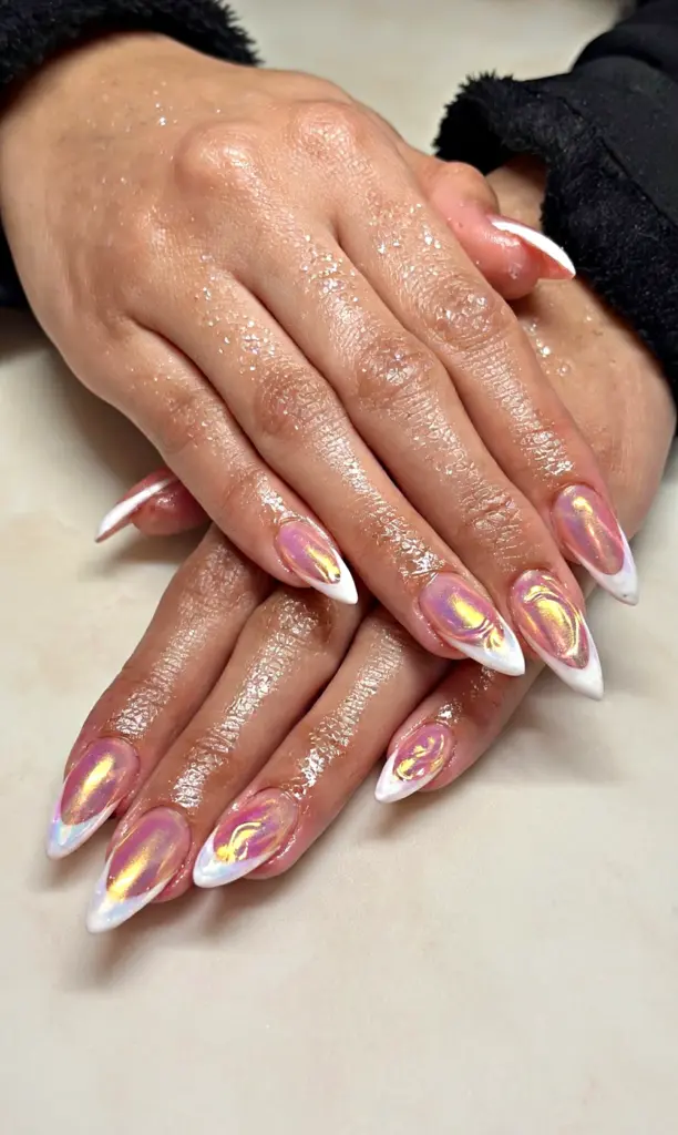 Medium stiletto Gel X nails with pink aurora chrome and a white French tip at NAB Nail Bar in Las Vegas