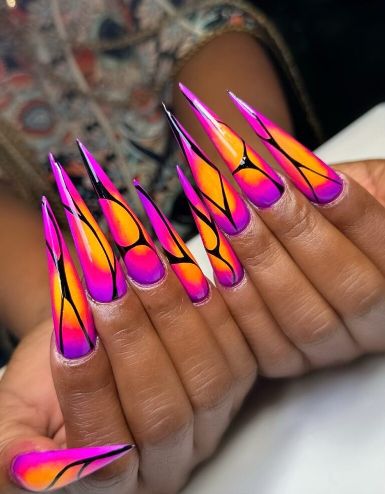 Neon pink and orange stiletto acrylic full set with black line art at NAB Nail Bar, Las Vegas