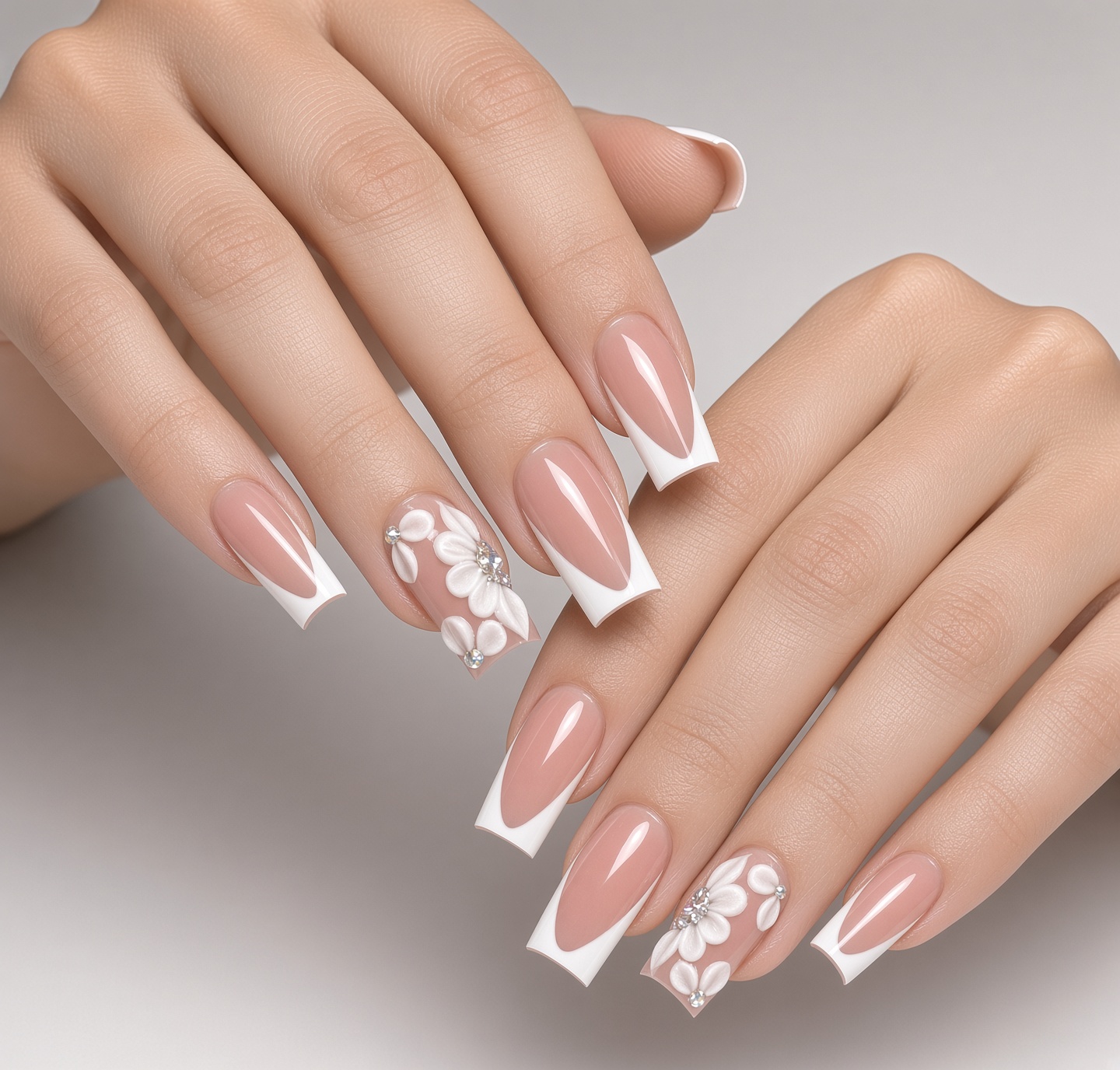 Nude bridal nails with a white v shaped french tip and a sculpted 3d white flower done at nab nail bar in las vegas nab nail bar