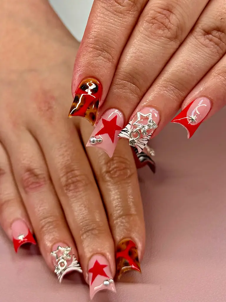 Short gel x duck nails with red stars tortoiseshell leopard and silver star charms at nab nail bar in las vegas nab nail bar