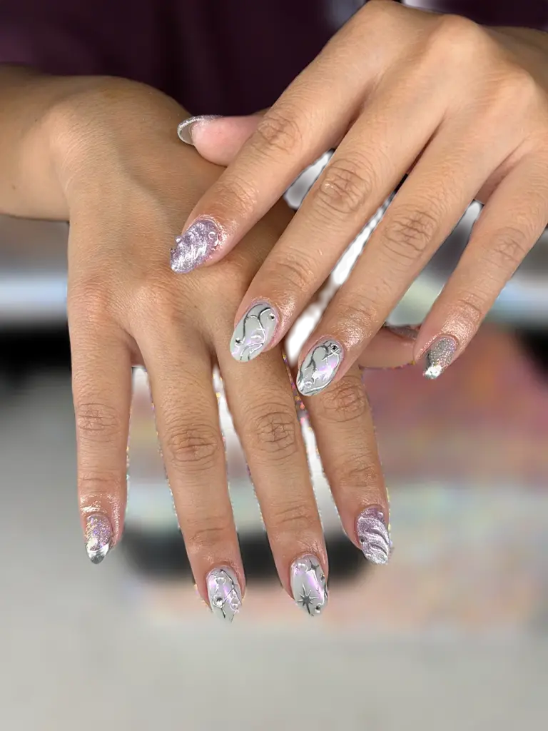 Short oval Gel X nails with silver chrome, lavender cat eye, aurora and 3D silver lines at NAB Nail Bar in Las Vegas