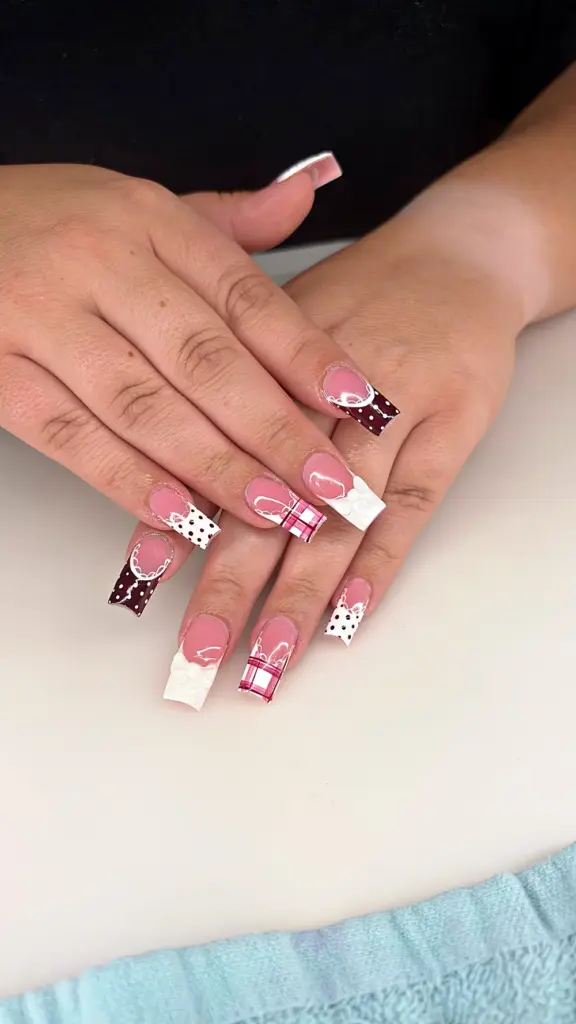 Short square Gel X nails with burgundy polka dots, pink plaid and 3D white bows at NAB Nail Bar in Las Vegas