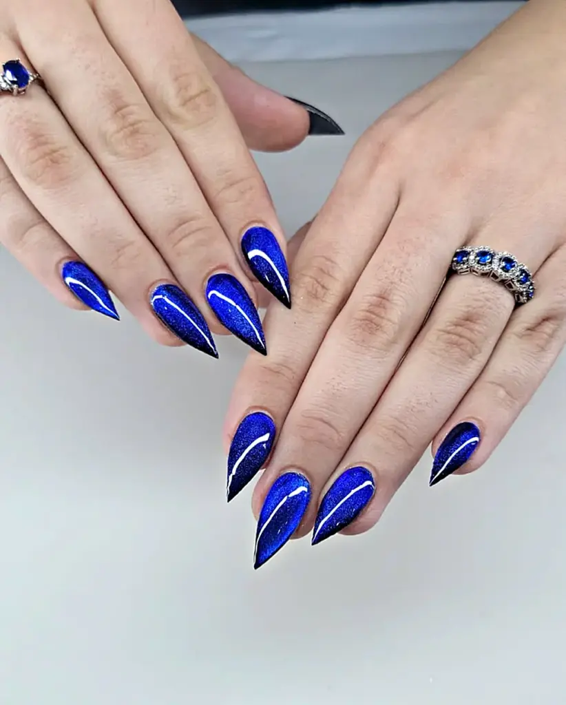 Short stiletto Gel X nails in cobalt blue cat eye at NAB Nail Bar in Las Vegas